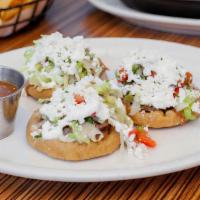 Sopes · Three rounds of house-made masa with beans and topped with your choice of carne asada, carni...