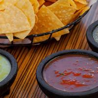 Chips & Salsa Flight · House red, tomatillo and avocado salsas. Vegan. Gluten-free.