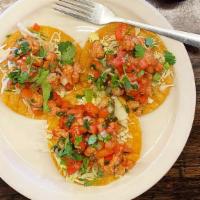 Tostadas De Ceviche De Soya · Three crispy corn tortillas with soy protein, tomatoes, onions, jalapenos and lime juice. To...