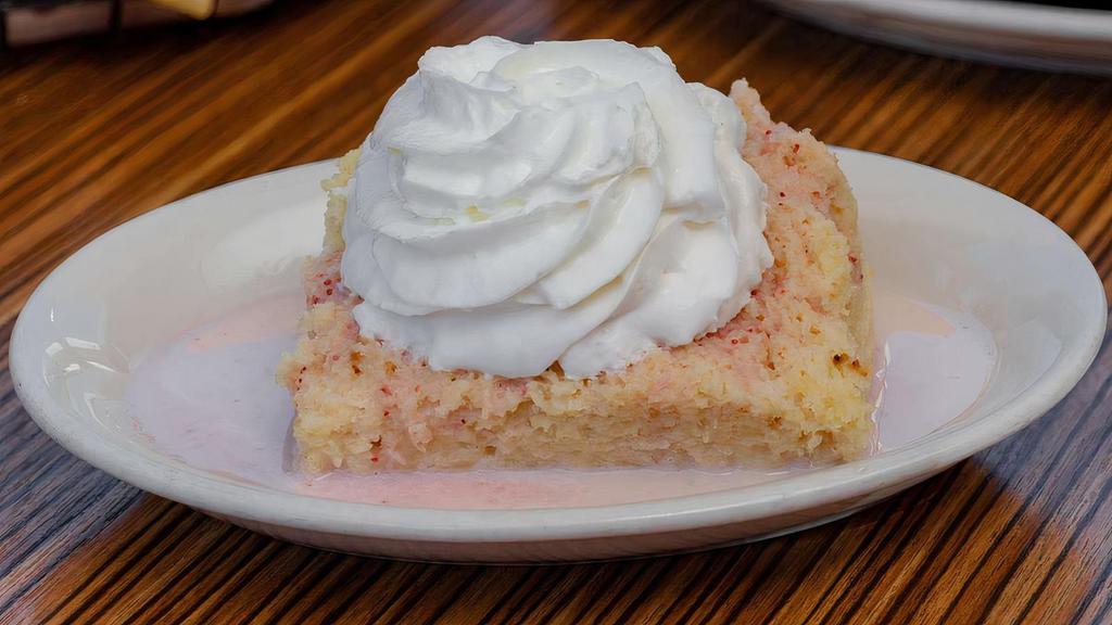 Tres Leches Cake · Handcrafted traditional Mexican cake topped with strawberry puree and whipped cream. Vegetarian.