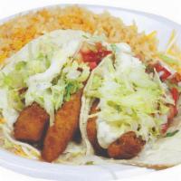 2 Fish Tacos · 2 fish tacos with pico de gallo, lettuce and tartar sauce, rice, and beans.