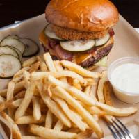 Western Burger · Half pound ground chuck patty, cheddar, pickles, onion ring, bacon, bbq and 1000 island dres...