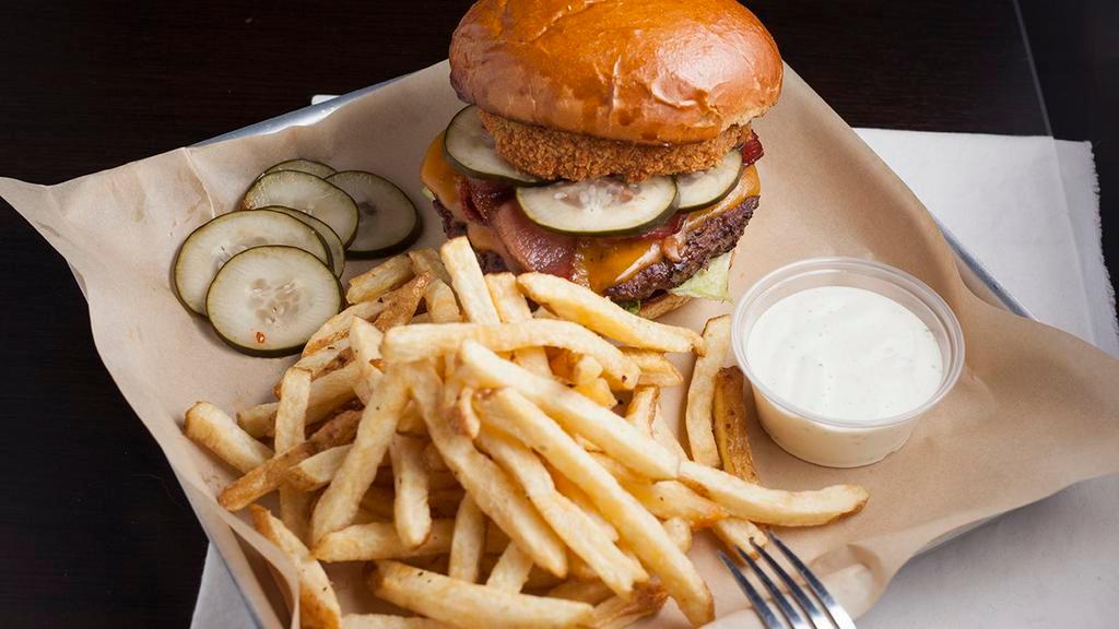 Western Burger · Half pound ground chuck patty, cheddar, pickles, onion ring, bacon, bbq and 1000 island dressing.