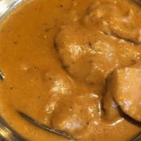 Chicken Coconut Korma · Breast chicken cooked with onion, tomatoes, coconut milk, and cashew nuts.