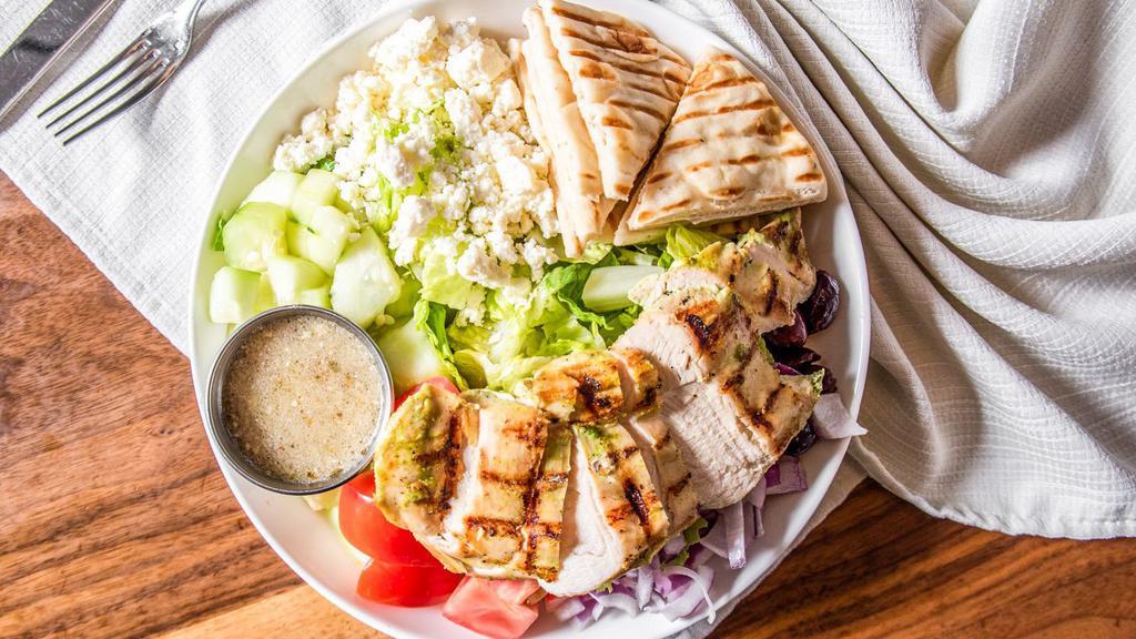 Santorini Greek Salad With Chicken (Gf) · Grilled chicken breast, romaine, feta crumbles, red onions, tomatoes, cucumbers, and Kalamata olives with Greek dressing. Does not come with pita bread.