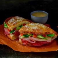 Italian Deli Boat · Pizza dough baked into a crunchy, golden crust then topped with butter and romano. Layered w...
