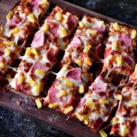Hawaiian Pizza · Mozzarella cheese, ham, bacon, and pineapple.