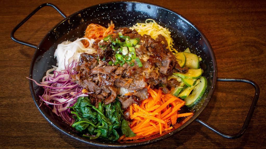 Veg Bibimbop · Vegetarian. Vegan. Veggies with carrot, spinach, red cabbage, bean sprout, zucchini, radish, shredded egg, and steamed rice with your choice of 1 of our house-made sauces - spicy bibimbap sauce or mild bulgogi sauce.