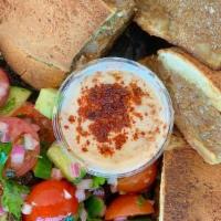 Arayes · wagyu beef toasted inside a pita, Israeli salad, tahini
