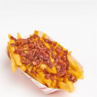 Bacon Cheese Fries · Crispy fries topped with bacon and cheese wiz.