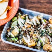 Spicy Sprouts · Crispy Brussels sprouts, Verde spice, jalapeño crema, cotija