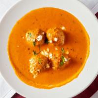 Malai Kofta Curry · Cheese dumplings stuffed with dried fruits, simmered in a rich cashew sauce. Served with rice.