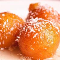 Gulab Jamun · Lustrous brown creamy cheese balls in rose syrup.