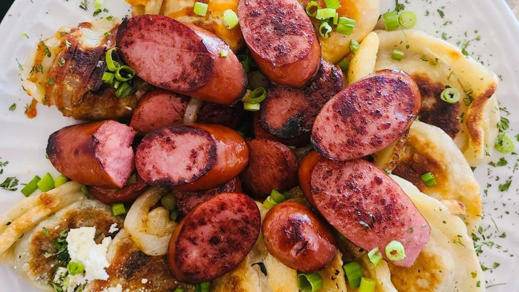 The Kielbasa Pierogi Plate (Full Order)  · A full dozen of our scrumptious Ruskie (Potato & Cheese) dumplings with a healthy portion of grilled & glazed sausage slices seared with caramelized onions, butter, a touch of parsley and seasoned to perfection! Feeds up to two!