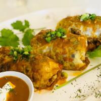  Gołąbki (Stuffed Cabbage Rolls) · Mika's favorite dish! Comes with two mouthwatering cooked cabbages stuffed with tender groun...