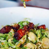 Warm Shaved Brussels Sprout · Favorite. Pistachio crumb, house smoked pork belly burnt ends, green onion, honey mustard dr...