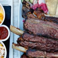 Beef Ribs · Three-bone beef rib meant for two or more, comes with two sides.