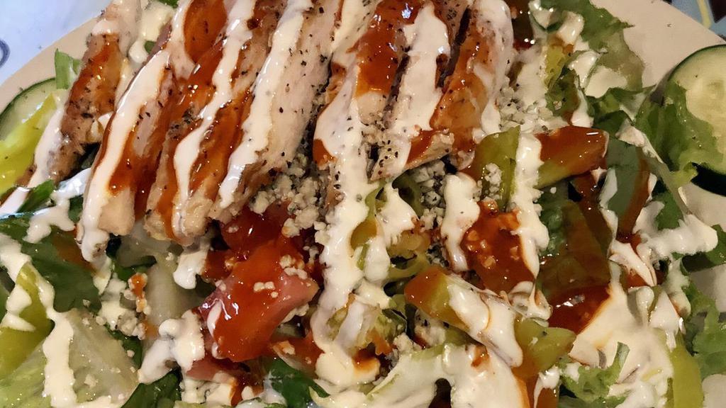 Buffalo Chicken Salad · Grilled chicken tossed in buffalo sauce, romaine, pepperoncini, tomatoes, cucumbers, crumbled bleu cheese. Served with bleu cheese dressing.