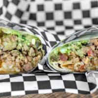 Mexi Burrito · Choice of protein, Mexican rice, pinto beans, crema, guacamole, pico de gallo, salsa and jal...