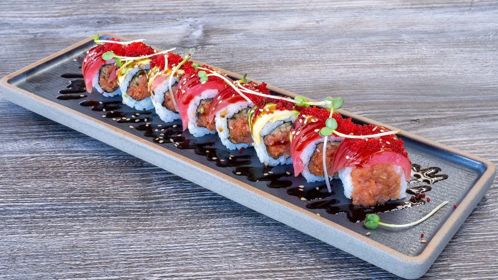 Tuna Lover Roll · Spicy tuna and cucumber inside, fresh tuna and topped with tobiko and eel sauce. If you are a fan of Tuna, this is a must have.