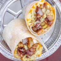 Breakfast Burrito · scrambled eggs brought together with tater tots and thick cut bacon or sausage, then put in ...
