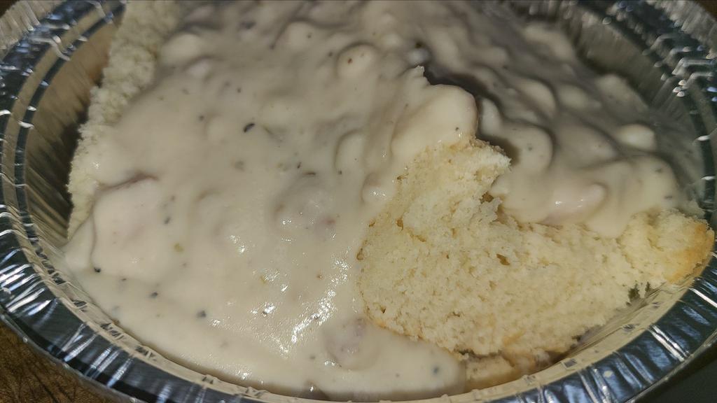 Biscuit And Gravy · Biscuit made in-house then topped with Karna's homemade sausage and bacon gravy.