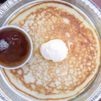 Original Flapjacks · Fluffy  flapjacks griddle cooked and served with butter and warm syrup.