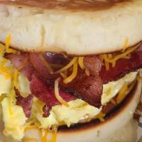 Flapjacks Breakfast Sandwich · 2 mini flapjacks stuffed with an egg, 2 slices bacon or sausage patty and melted cheese.