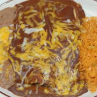 Enchilada De Mole · Two corn tortillas stuffed with tender chicken topped with our delicious sweet, spicy Mexica...