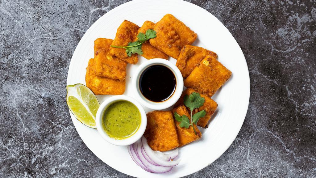 Vegetable Pakoras · A popular Indian street food ! Fresh vegetables, coated in spiced gram flour and deep fried.