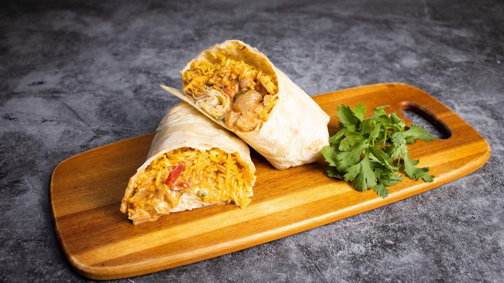 Chicken Tikka Burrito · Crowd favorite chicken tikka masala wrapped in a warm tortilla with rice, channa masala, dal, diced tomatoes & onions.