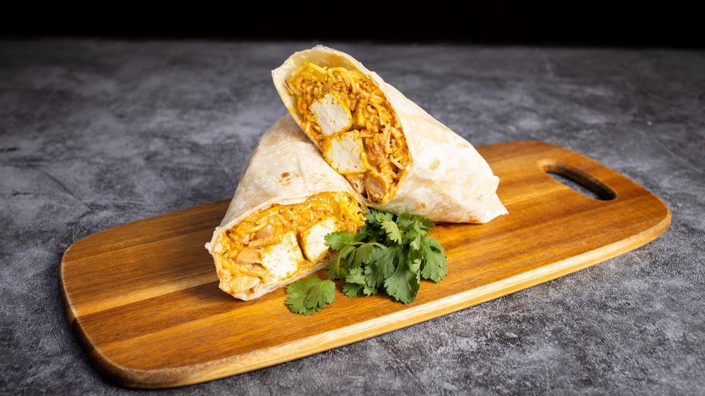 Paneer Tikka Burrito · Indian classic paneer tikka masala wrapped in a warm tortilla with rice, channa masala, dal, diced tomatoes & onions.