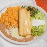 Chimichanga · Shredded beef pork or chicken breast wrapped in a hard shell flour tortilla. Served with sal...