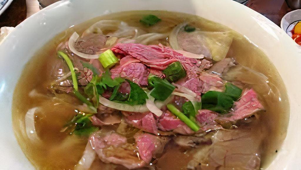 Phở Đặc Biệt · Dalat special combination beef noodle soup (top round steak, flank, lean brisket, tendon, tripe and meat balls).