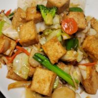 Stir-Fried Vegetables With Tofu · Served with steamed rice.