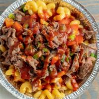 Meaty Mac · Cheddar Mac, Chopped BBQ Tri-Tip, Sauteed Onion, Red and Green Bell Peppers, Drizzled with B...