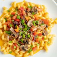 Cheddar Veggie Mac · Vegetarian.  Cheddar Mac loaded with Sauteed Mushrooms, Onions, red and Green bell Pepper, D...