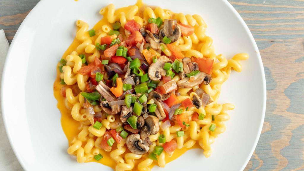Cheddar Veggie Mac · Vegetarian.  Cheddar Mac loaded with Sauteed Mushrooms, Onions, red and Green bell Pepper, Diced Tomato, and topped with Green Onion.