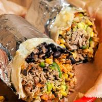 Chimichanga Burrito · Deep Fried Burrito, Topped with Guacamole, Sour Cream, Cheese, Lettuce, Beans, Beef, and Pic...