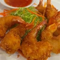 Coconut Shrimp · Deep-fried battered shrimps, served with sweet and sour sauce.
