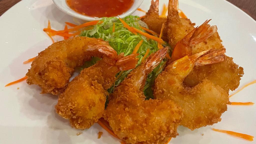 Coconut Shrimp · Deep-fried battered shrimps, served with sweet and sour sauce.