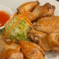 Chicken Wings · Deep-fried battered chicken wings, served with sweet & sour sauce.