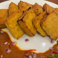 Tofu Satay · Grilled tofu marinated with mixture of spices, served with peanut sauce.