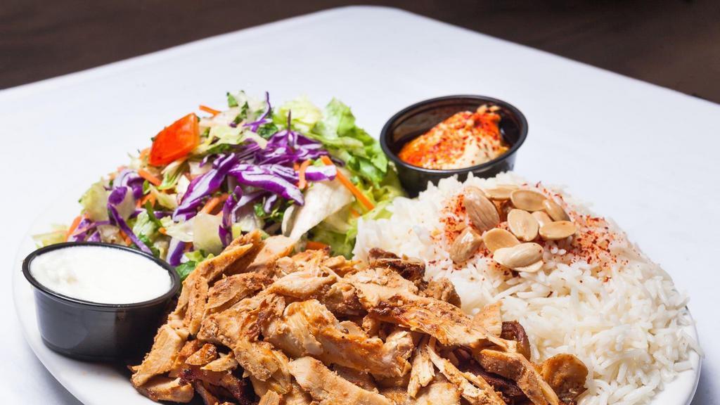 Chickenf Kabab Over Rice Plate · Beef, rice, mix salad, tzatziki, hummus and choice of sauce.