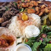 Beef Shawarma Plate · Lamb, rice, salad, tzatziki, and choice of sauce.