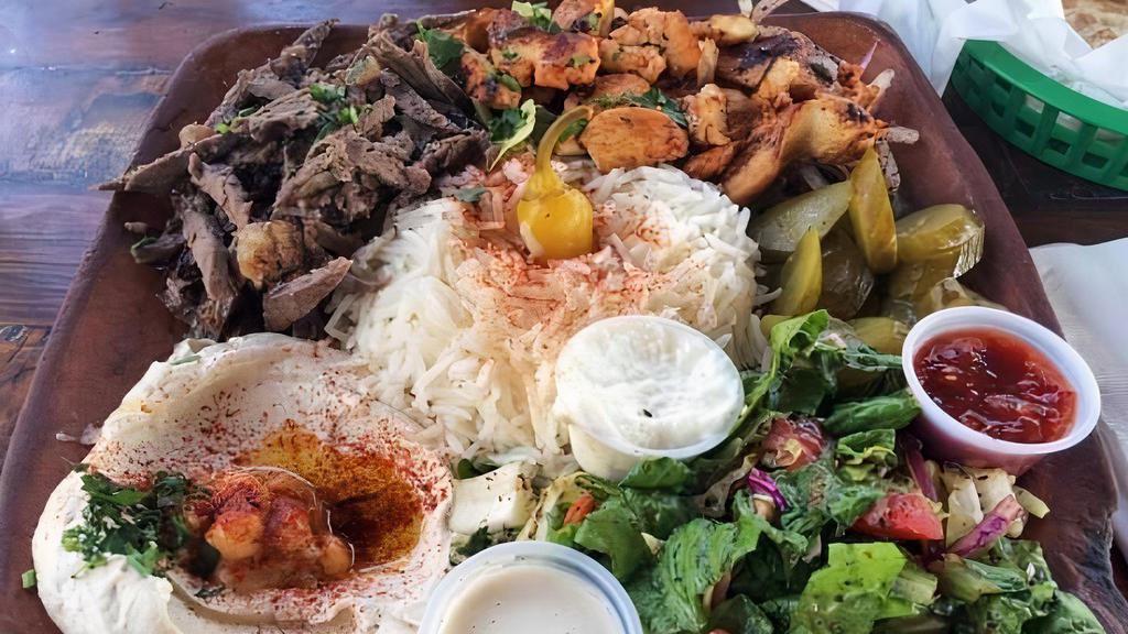 Beef Shawarma Plate · Lamb, rice, salad, tzatziki, and choice of sauce.