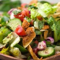 Fattoush · Lettuce, tomatoes, cucumber, radish, green onions and mint, seasoned with olive oil and lemo...