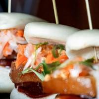 Belly Buns · Braised pork belly, pickled carrots and daikon micro cilantro, peanuts, hoisin sauce