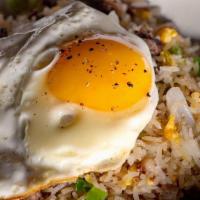 Oxtail Fried Rice · Oxtail, onions, sunny side up egg with rice