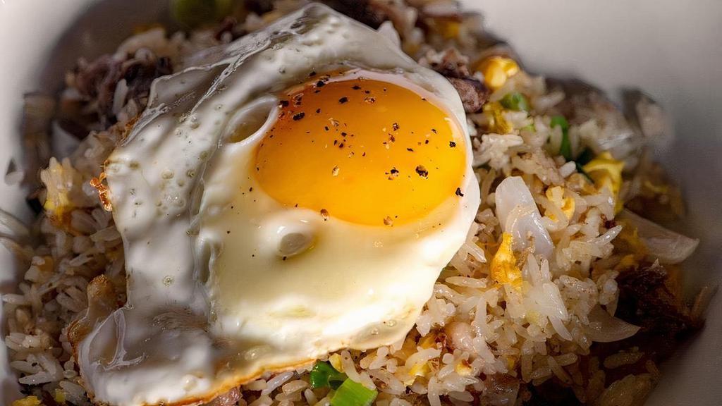 Oxtail Fried Rice · Oxtail, onions, sunny side up egg with rice